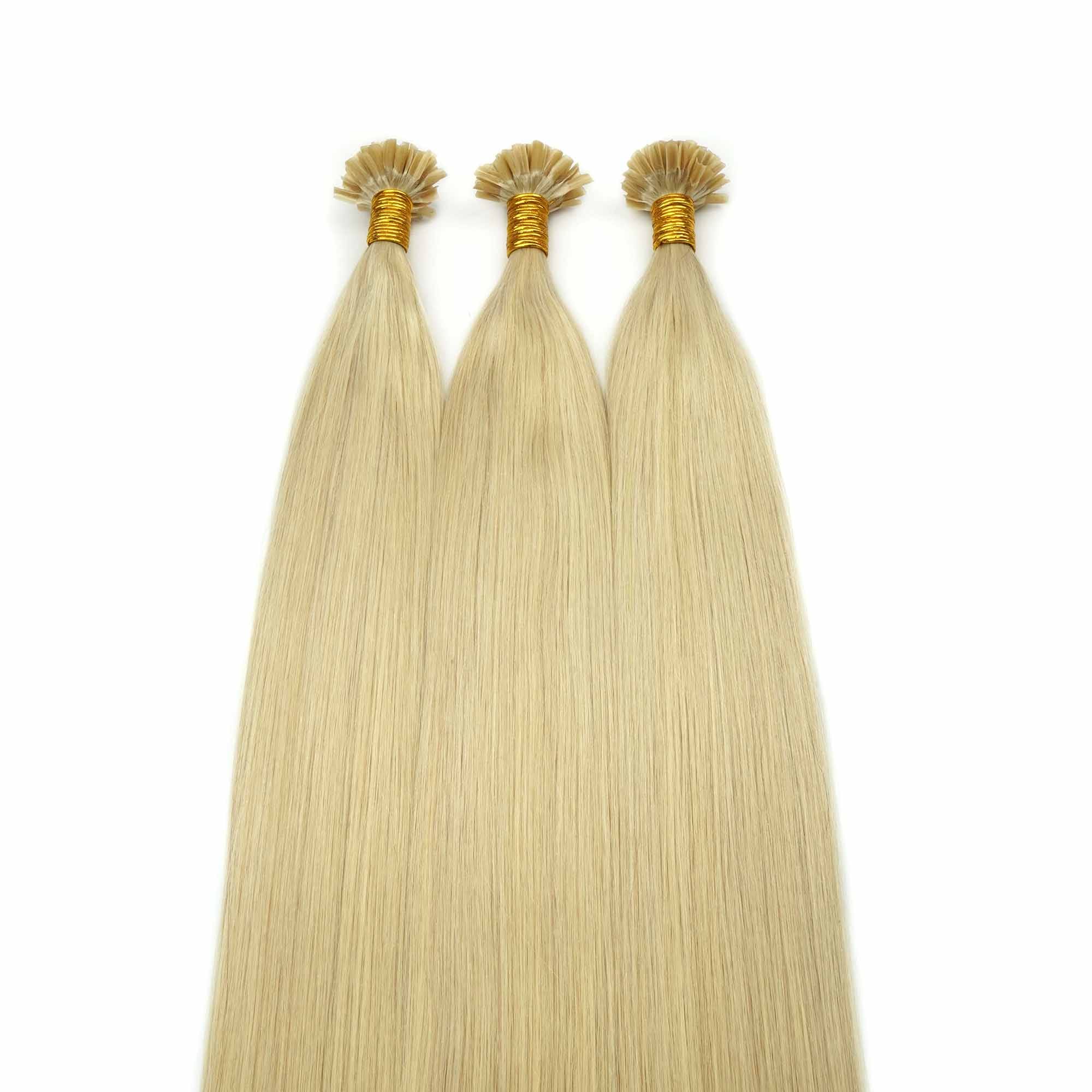 Straight blonde U Tip extensions for checking strand weight and heat bond consistency